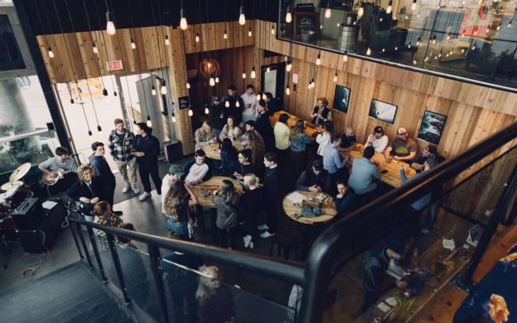 a crowd enjoys the tasting room at victoria's vancouver island brewing