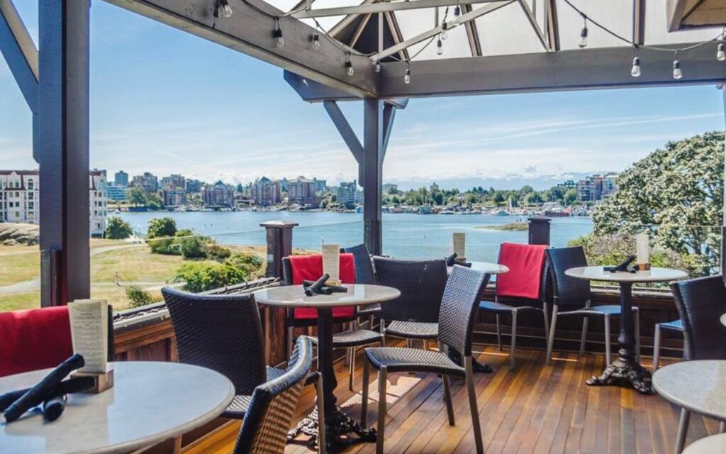 the patio at spinakkers gastropub overlooking victoria's inner harbour