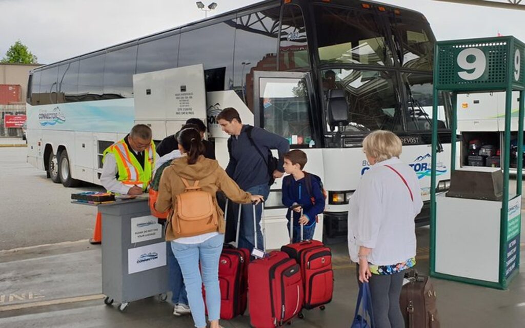 A group boards the BC Ferries Connector Bus for Victoria, BC.