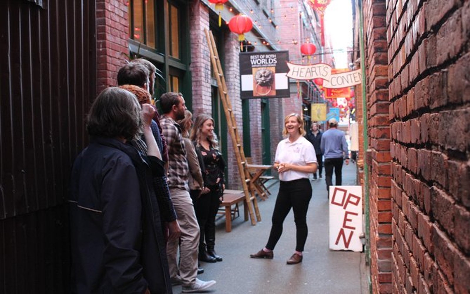 a group listens to their guide on one of our victoria food tours